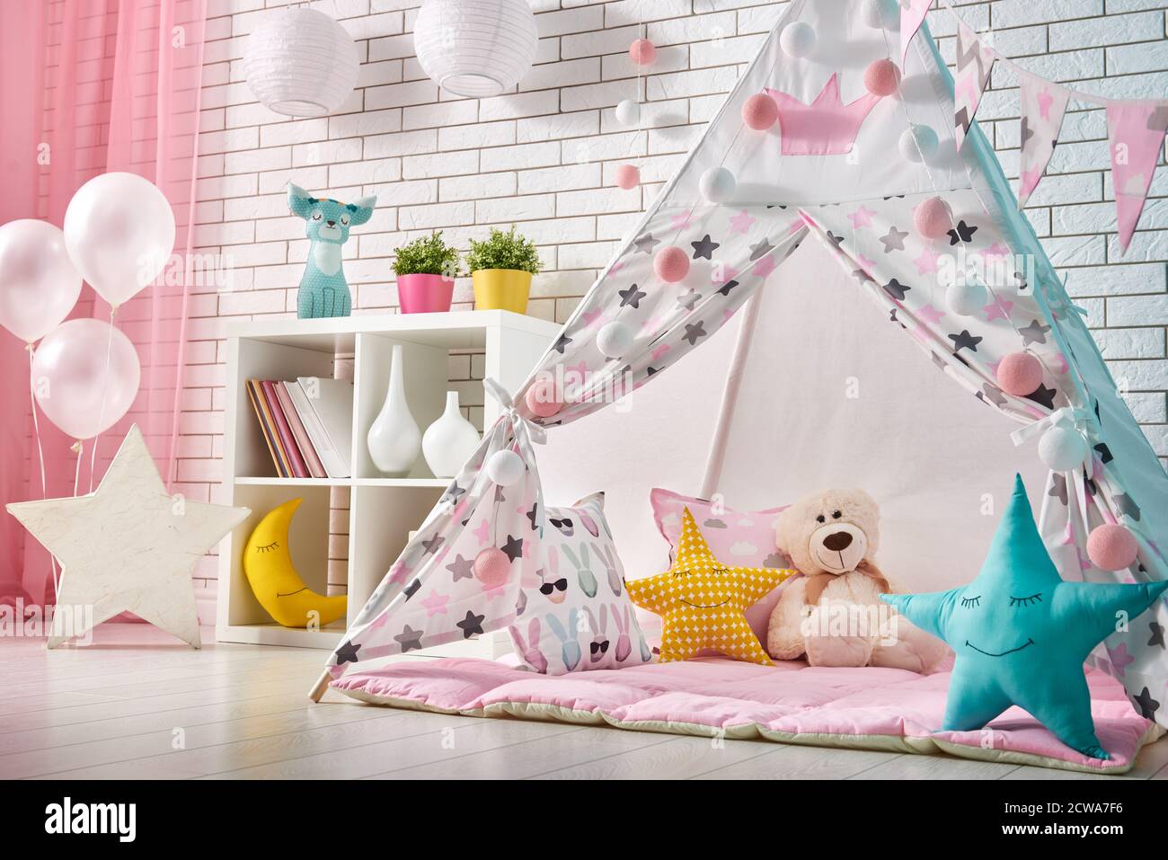 Spacious children room with play tent for girl Stock Photo - Alamy