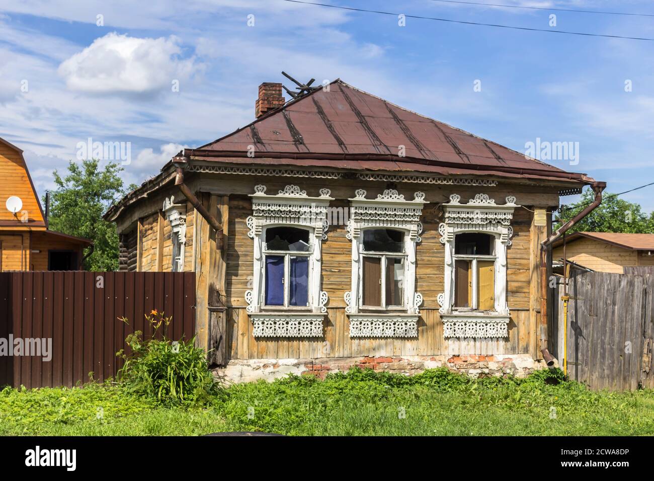 An old wooden house with traditional window frames. Nineteenth century architecture. Provincial town of Borovsk in Russia. Stock Photo