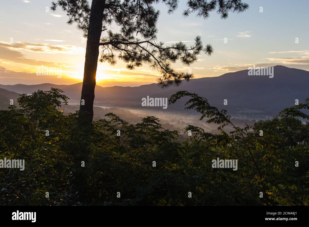 Morning Sunrise On Foothills Parkway. Sunrise over a misty valley as seen from an overlook on the recently opened section of the Foothills Parkway. Stock Photo