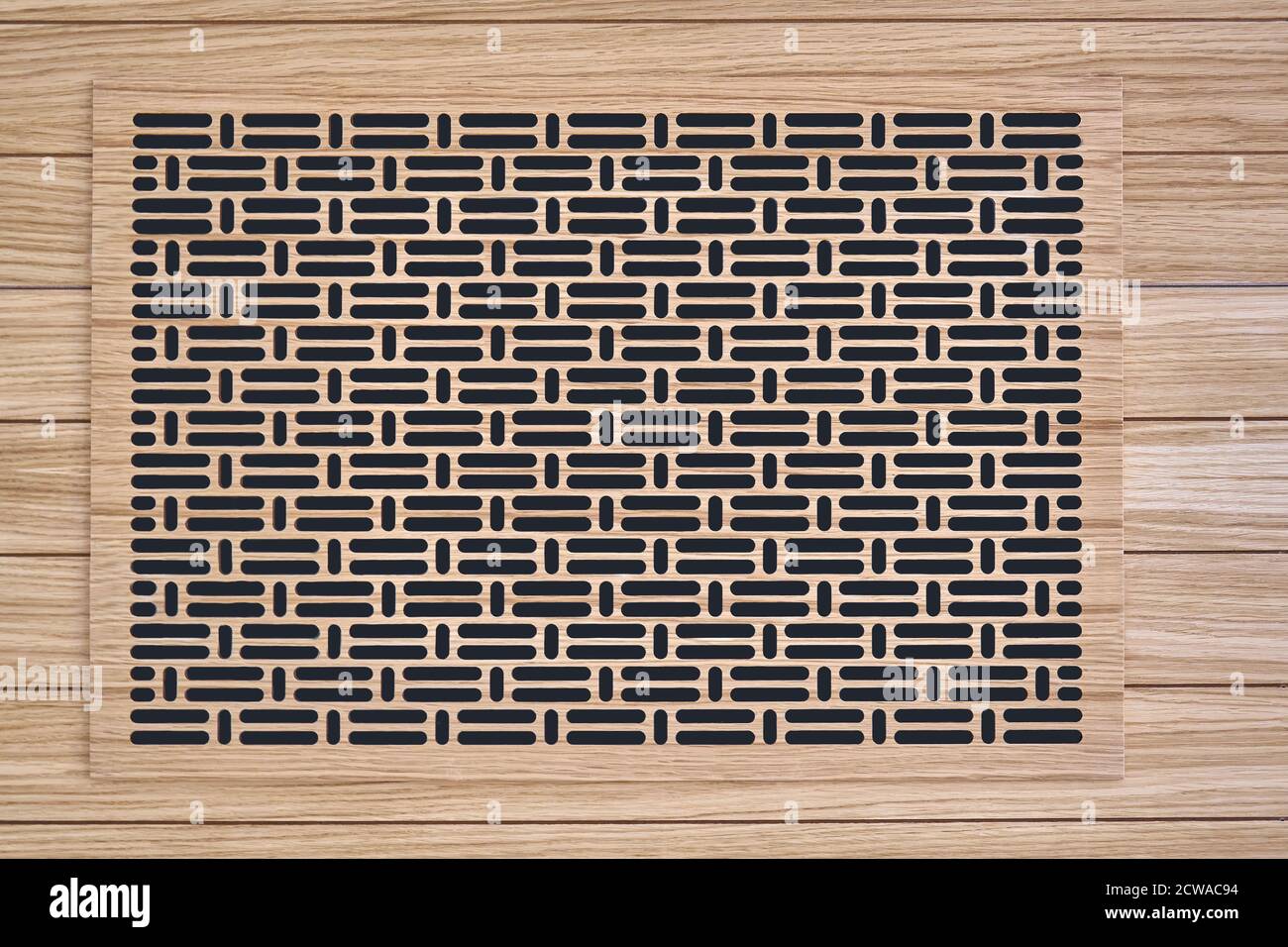 Decorative lattice. Wooden vent cover in wooden slats ceiling. Bottom