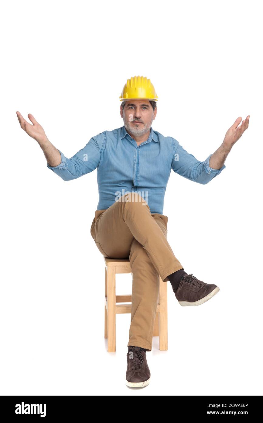 Crossed legs wearing blue jeans hi-res stock photography and images - Alamy
