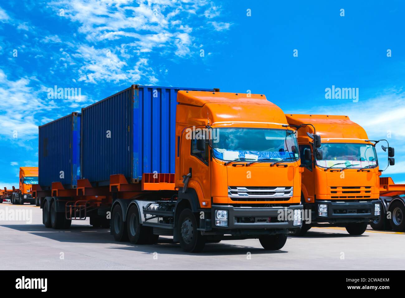 Truck trailer load with two twenty-foot containers delivering to factory. Stock Photo