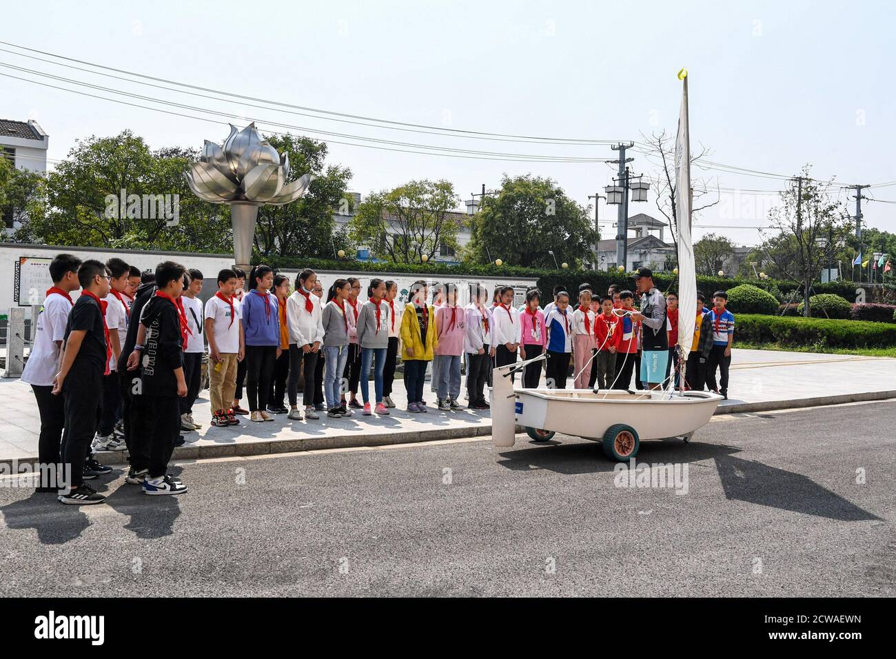 Suzhou. 24th Sep, 2020. Students attending a saling class in Suzhou of east China's Jiangsu Province, on Sept. 24, 2020. The Suzhou Linhu No.1 Central Primary School, which located by the Taihu Lake, started to teach sailing as a subject of the PE classes for their 5th grade students from 2017. Students attending the sailing classes were provided with professional coaching and sailboats. Credit: Li Bo/Xinhua/Alamy Live News Stock Photo