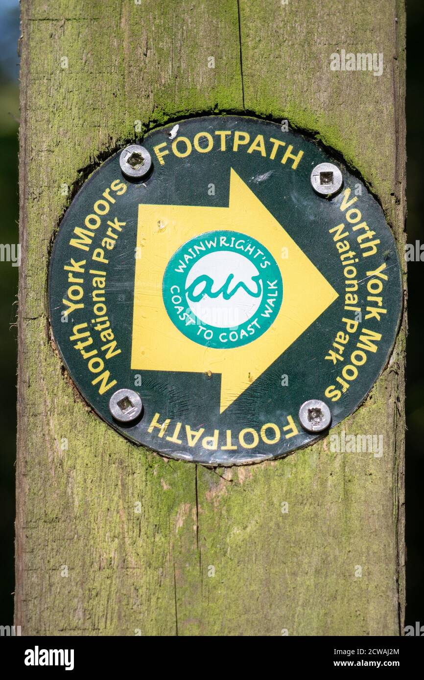 Wainwright's Coast to Coast walk footpath way marker as it passes through the North York Moors National Park, England, UK Stock Photo