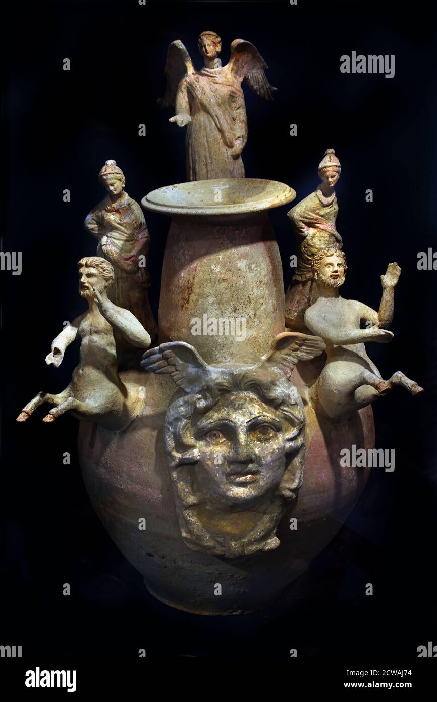 Terracotta vases from Canosa, in Italian Apulia, Grave goods to the deceased. The vase is highly ornamented with, amongst others, figures from Greek mythology: a medusa head to ward off evil and centaurs to accompany the deceased through the underworld. Hellenistic 335-30 BC Greek Greece Stock Photo