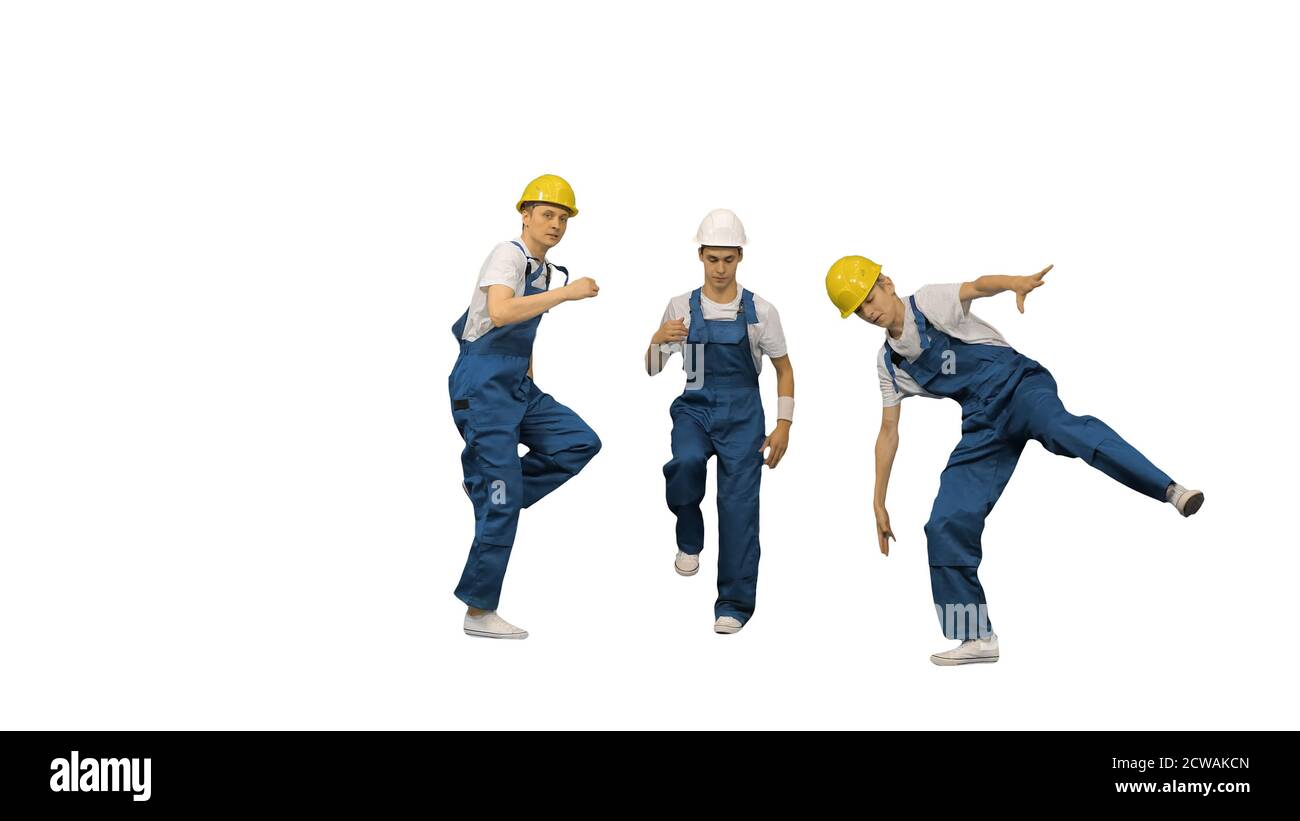 Three male construction workers in hard hats hoping into the cam Stock Photo