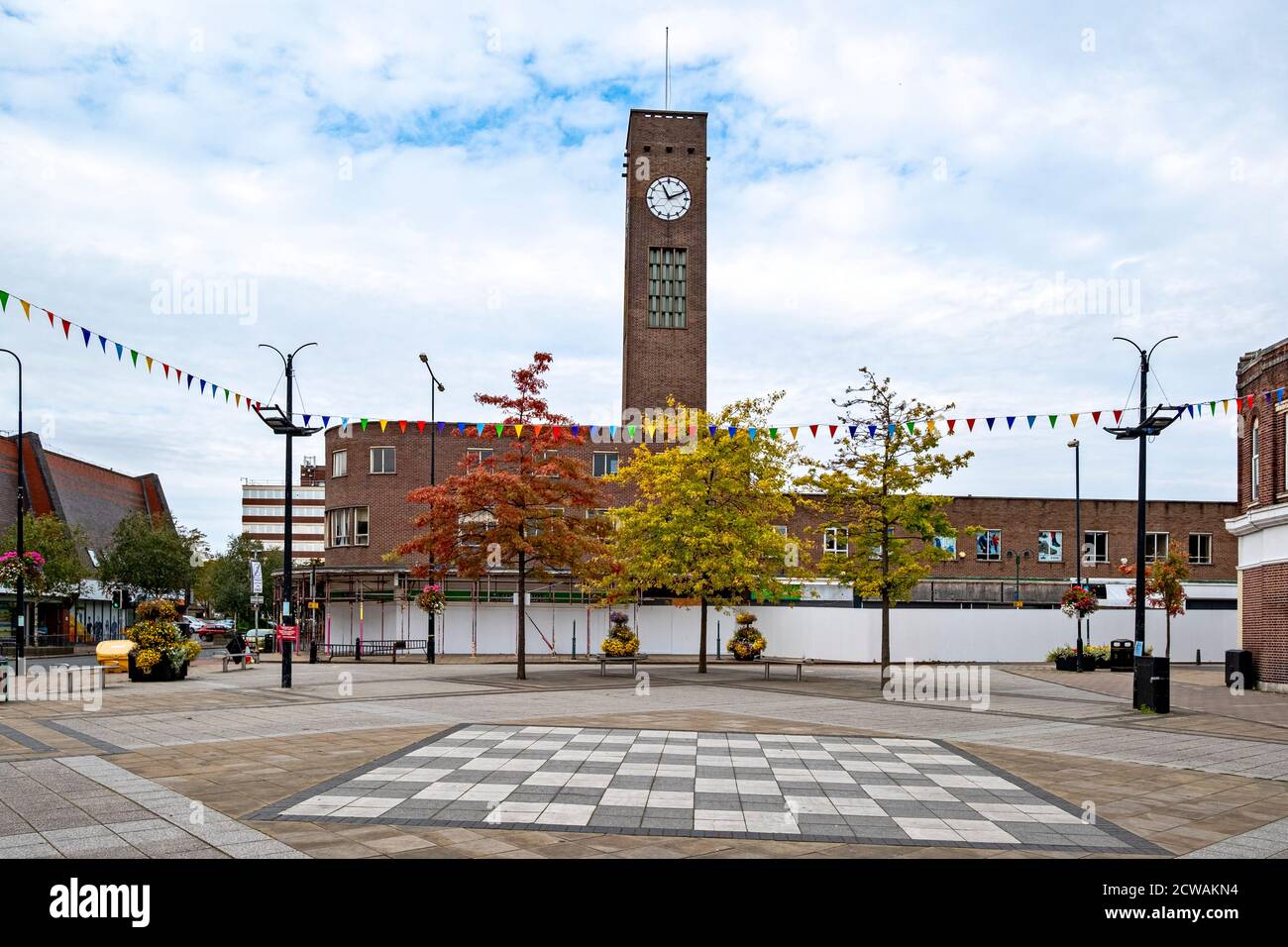 Town centre with clock tower and former war memorial location in Crewe Cheshire UK Stock Photo