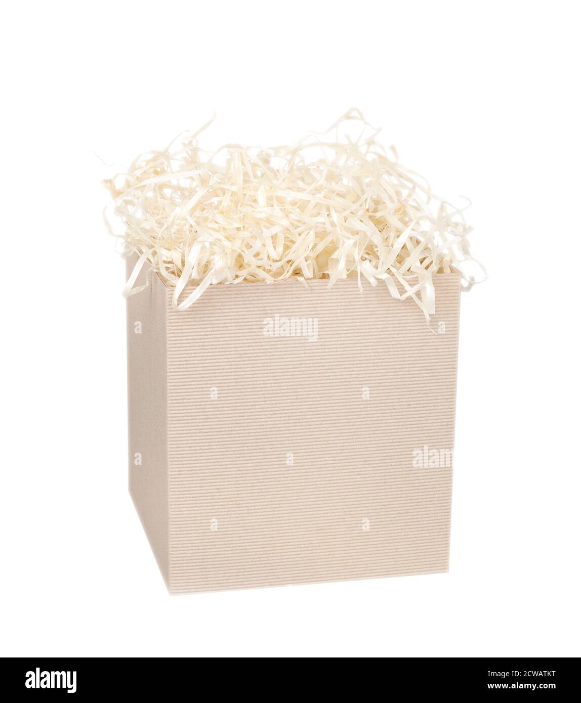 Cardboard box for eco gift filled with decorative shredded white paper/straw. Isolated on white. Stock Photo