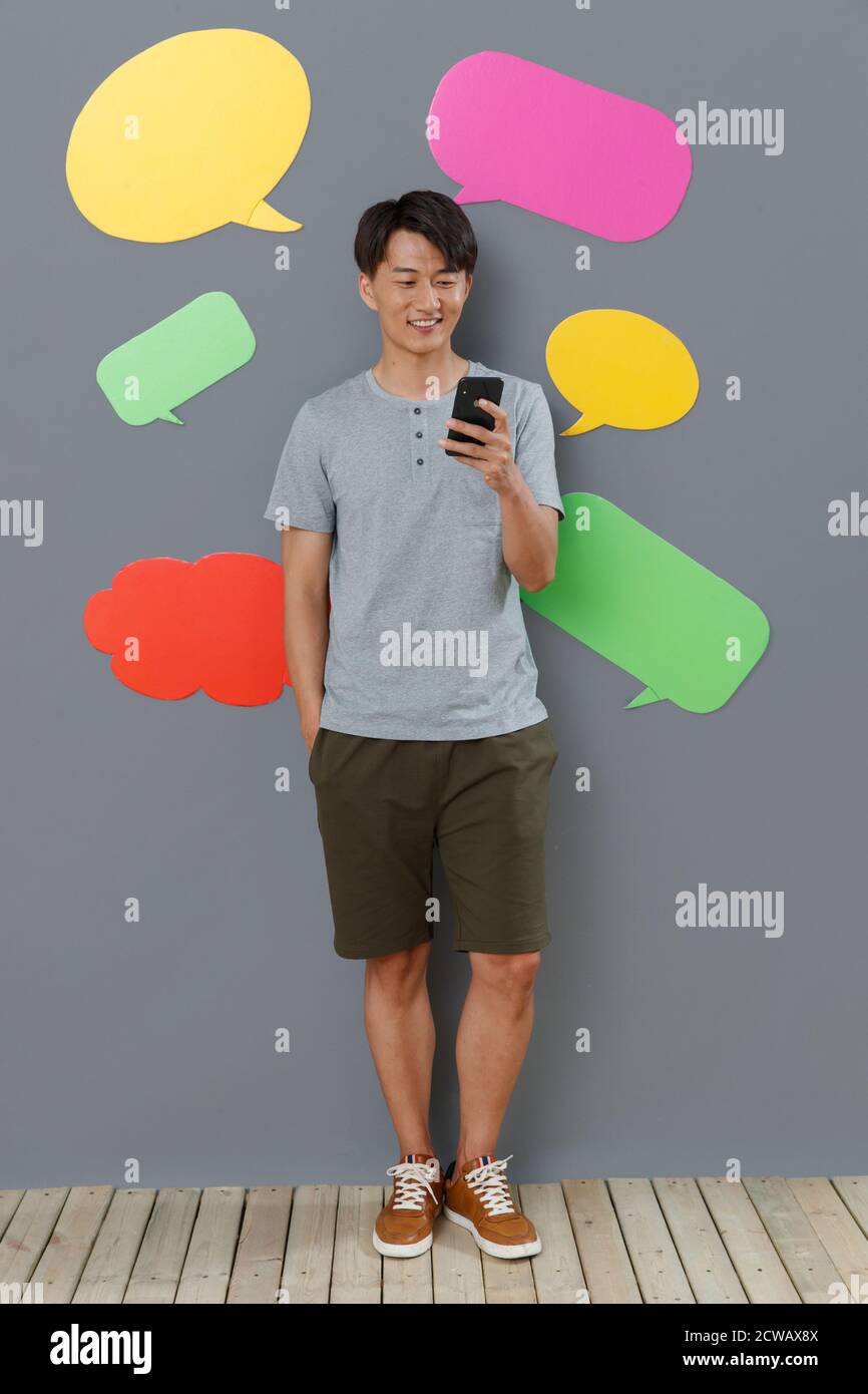 Take the young man mobile phone text messaging Stock Photo