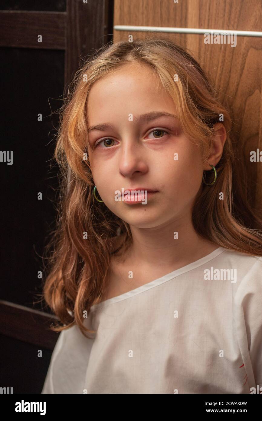 cute little kid is crying. Portrait of a sad child girl 9 or 10 years