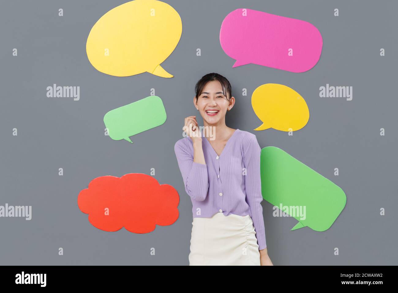 Happy girl standing in front of the dialog box Stock Photo - Alamy
