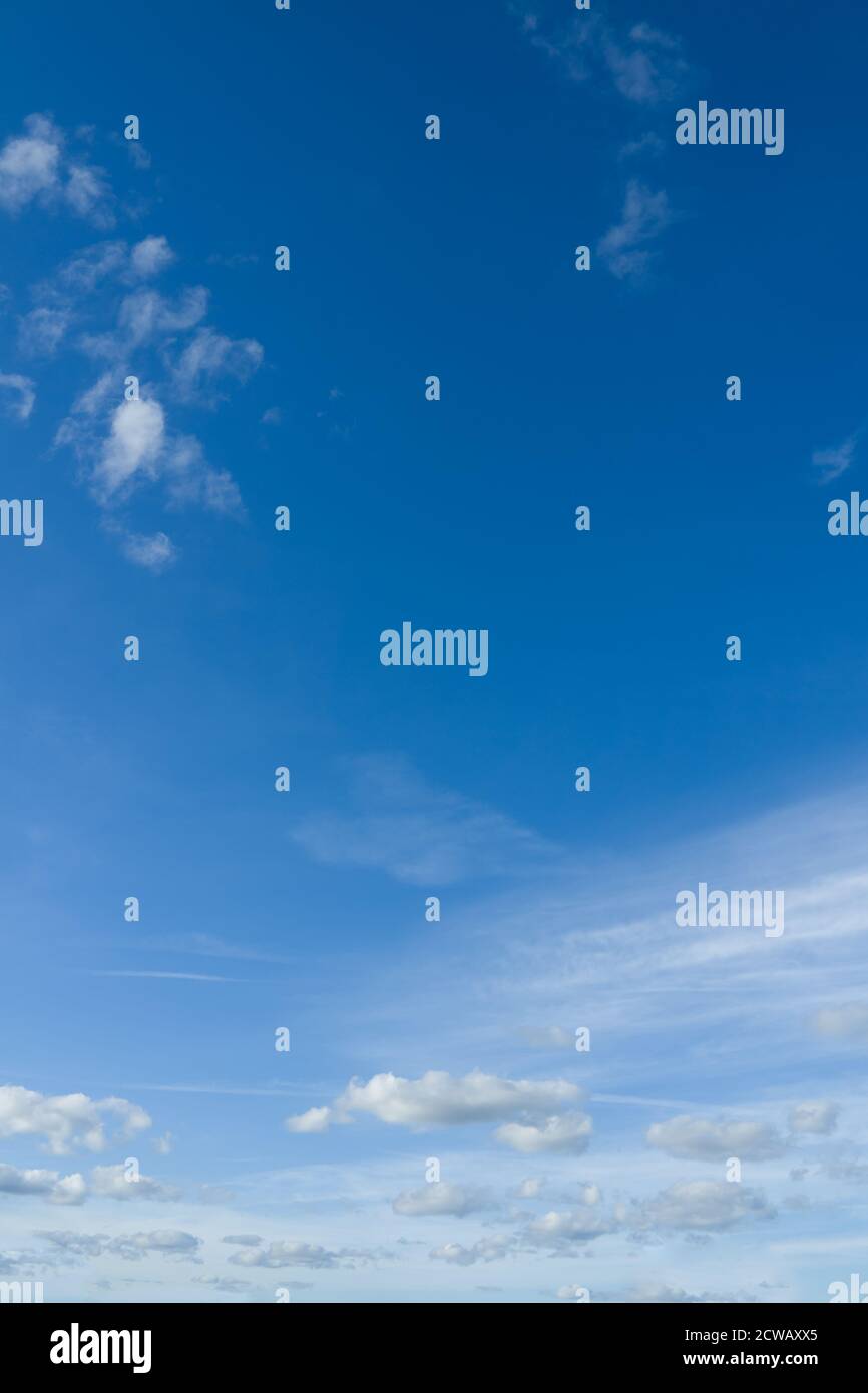 Beautiful vertical photo of bright sky and small clouds. Stock Photo