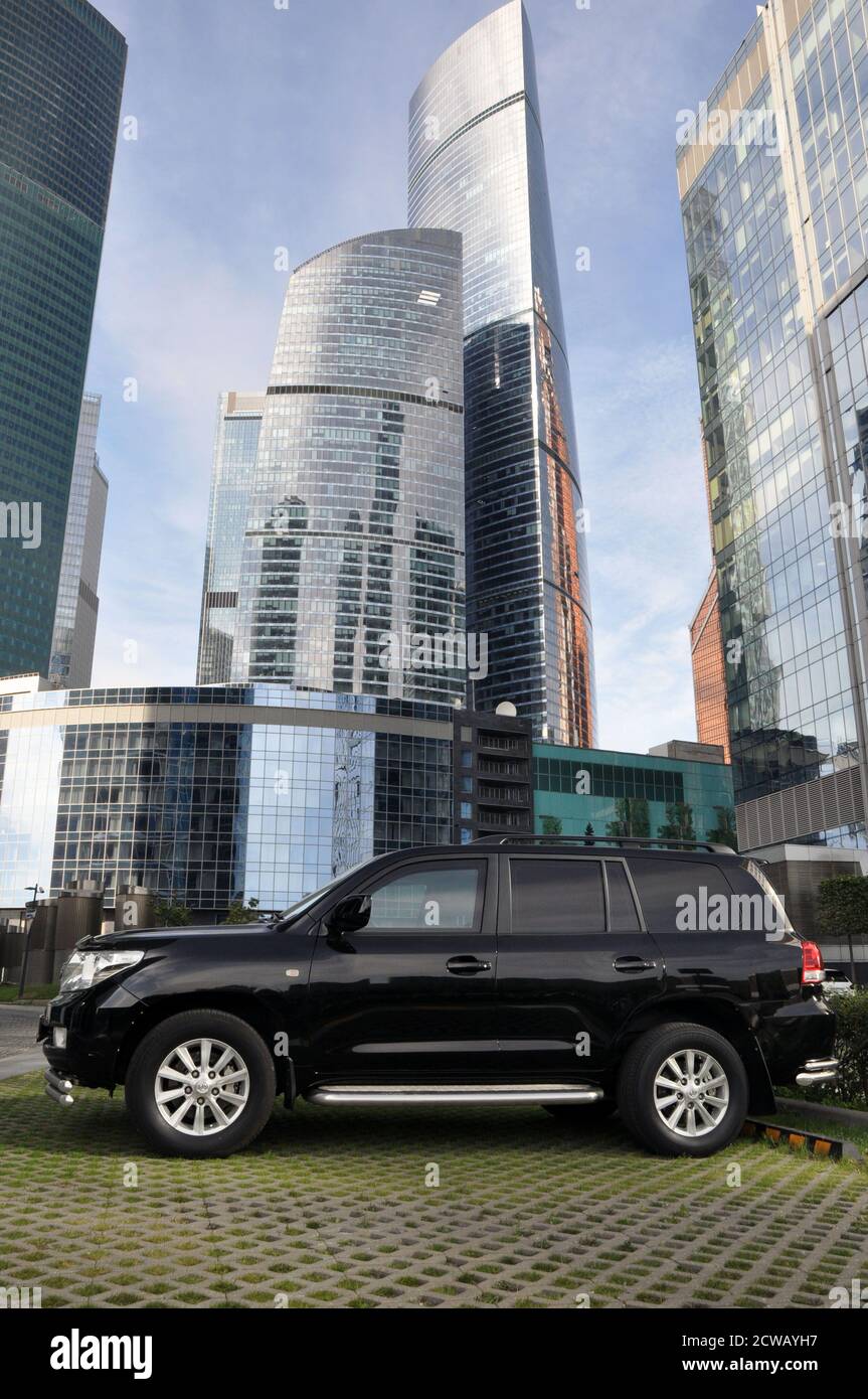 Toyota Land Cruiser is parked in a public ecological parking in the Moscow city business center. Stock Photo
