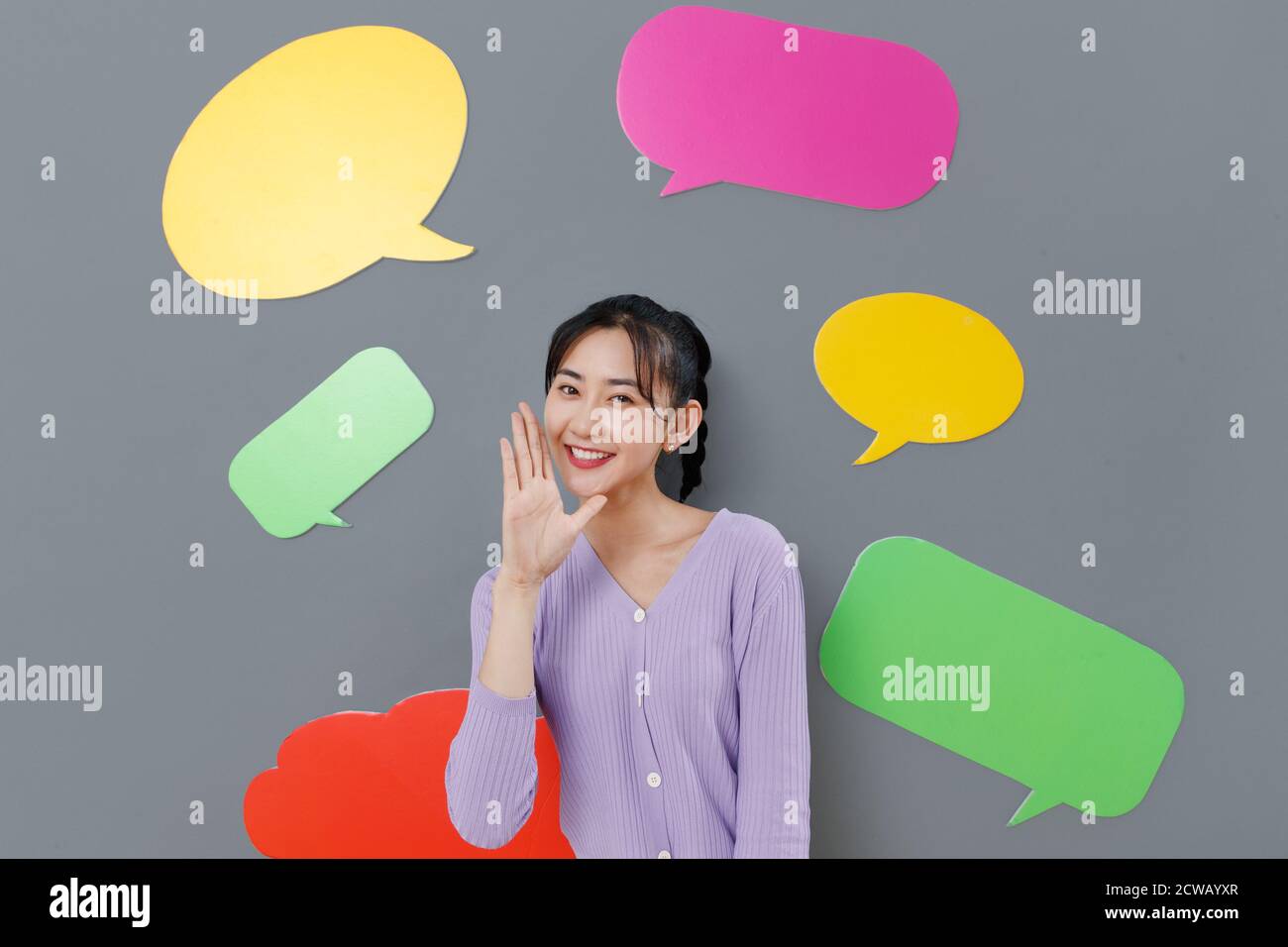 Happy girl standing in front of the dialog box Stock Photo - Alamy