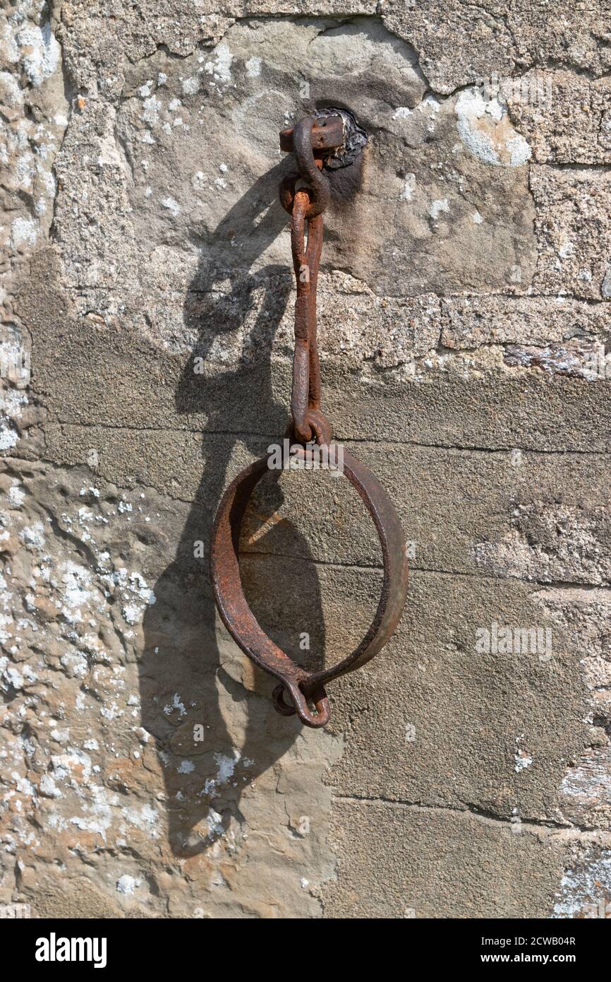 In olden days the these collars or Jougs were locked around the necks of felons to punish and shame offenders. Stock Photo