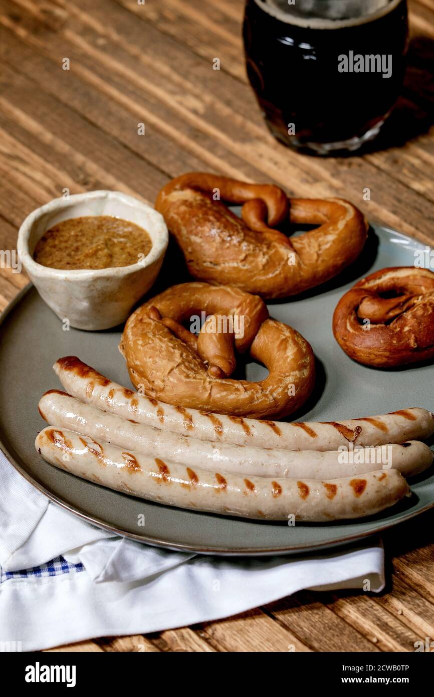 Bavarian traditional grilled pork sausages on ceramic plate served with