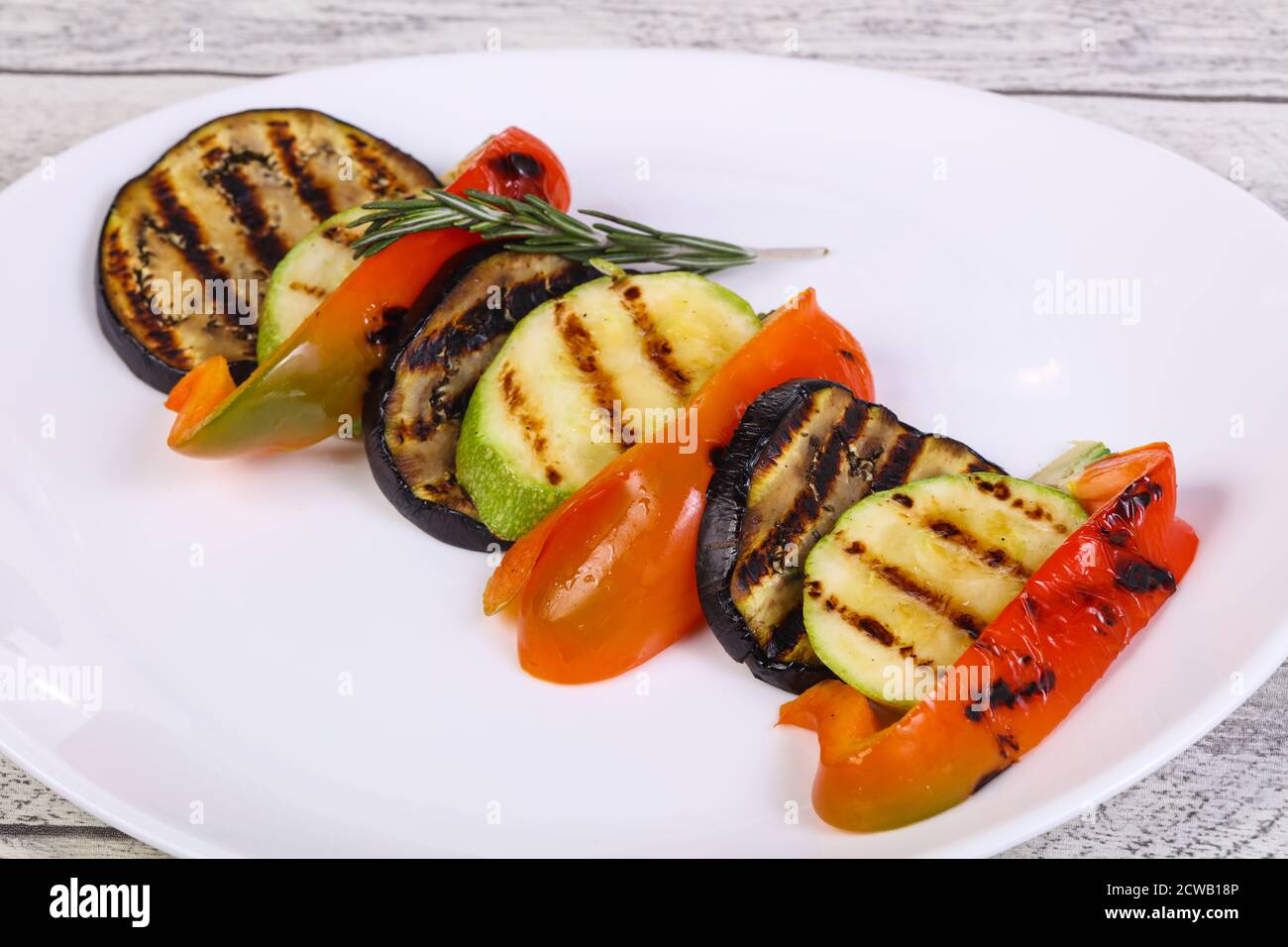 Grilled vegetables eggplant, zucchini and pepper in the plate Stock