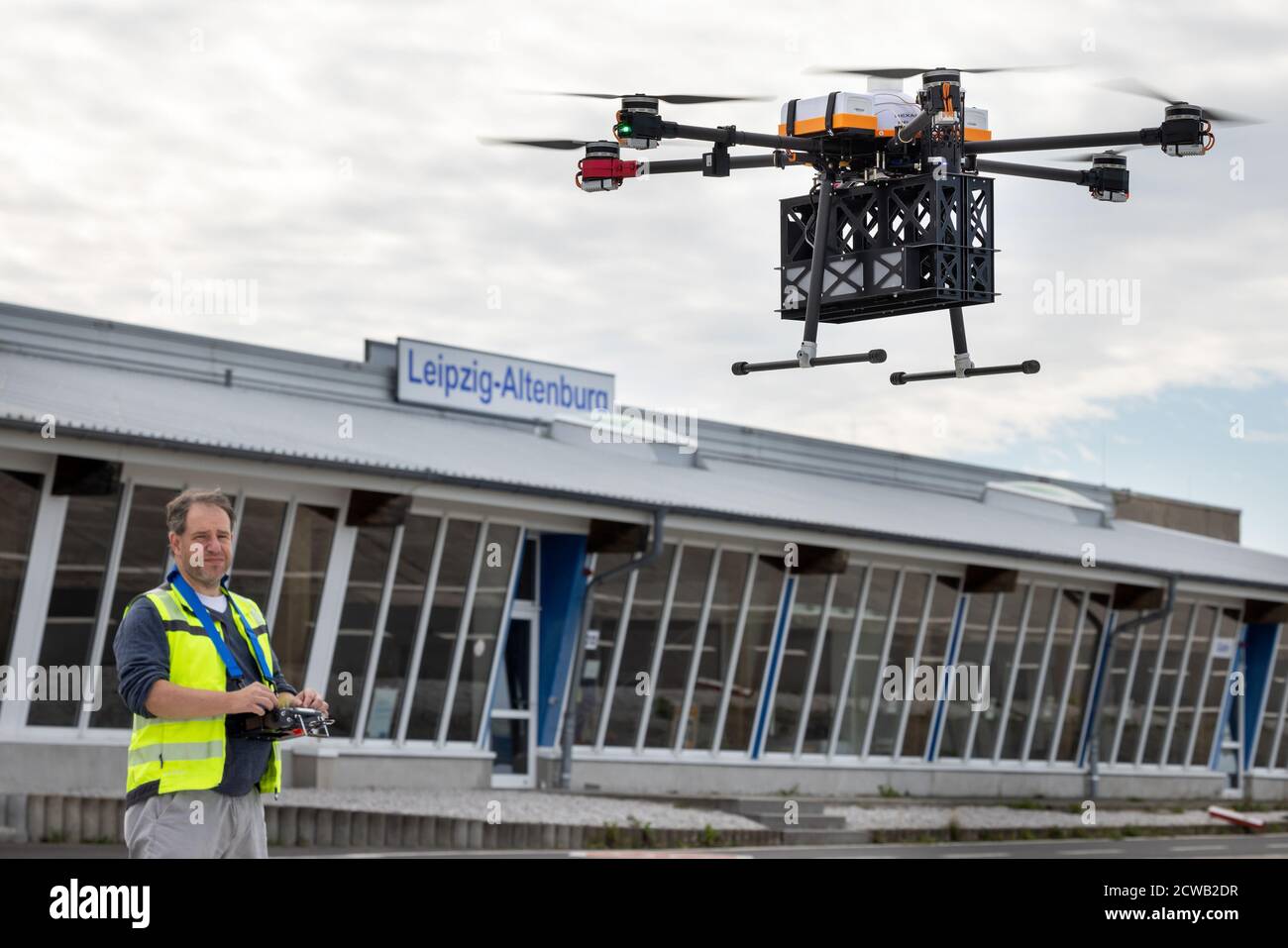 Altenburg Nobitz, Germany. 29th Sep, 2020. A hexacopter 'Paperboy' flies past the reception building of the Altenburg-Nobitz airfield during a presentation of newspaper delivery by the automatically flying drone, Uli Barth secures the automatic flight as a backup. The presentation is a project of the European Drone Centre e.V. Credit: Michael Reichel/dpa/Alamy Live News Stock Photo
