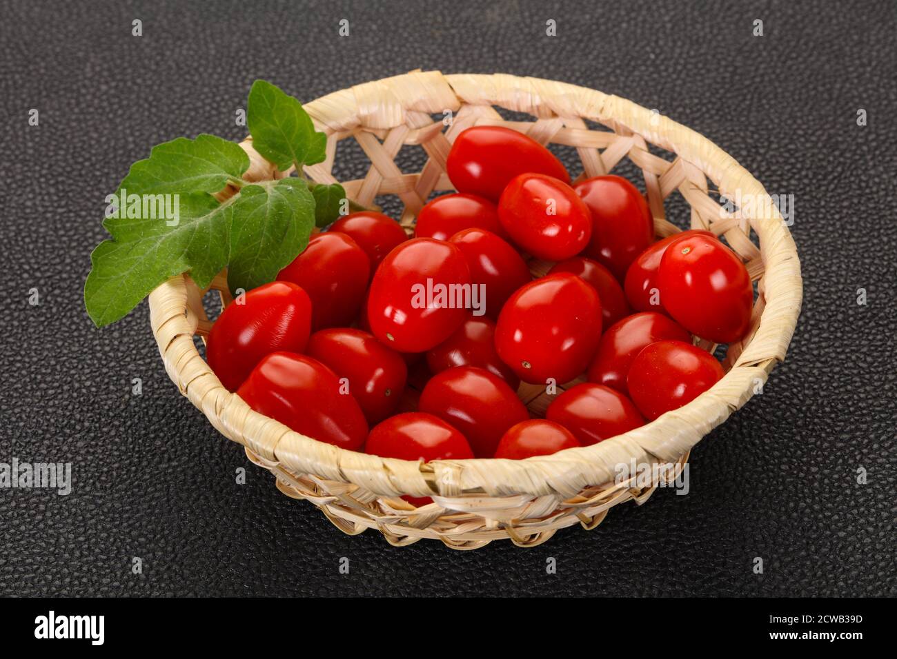 Sweet Red cherry tomatoes in the bowl Stock Photo - Alamy