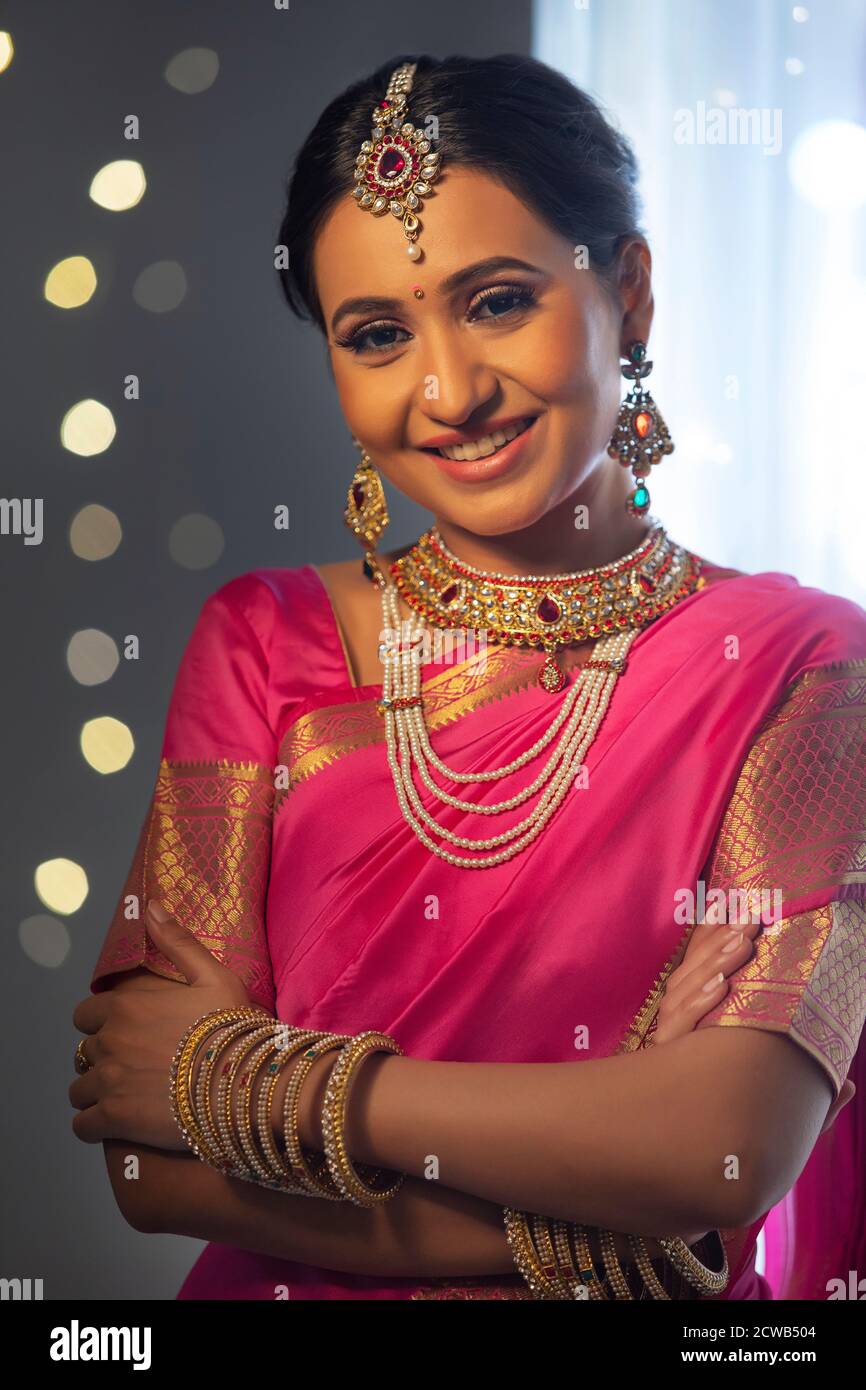 Beautiful woman smiling with her hands folded on the occasion of Diwali Stock Photo