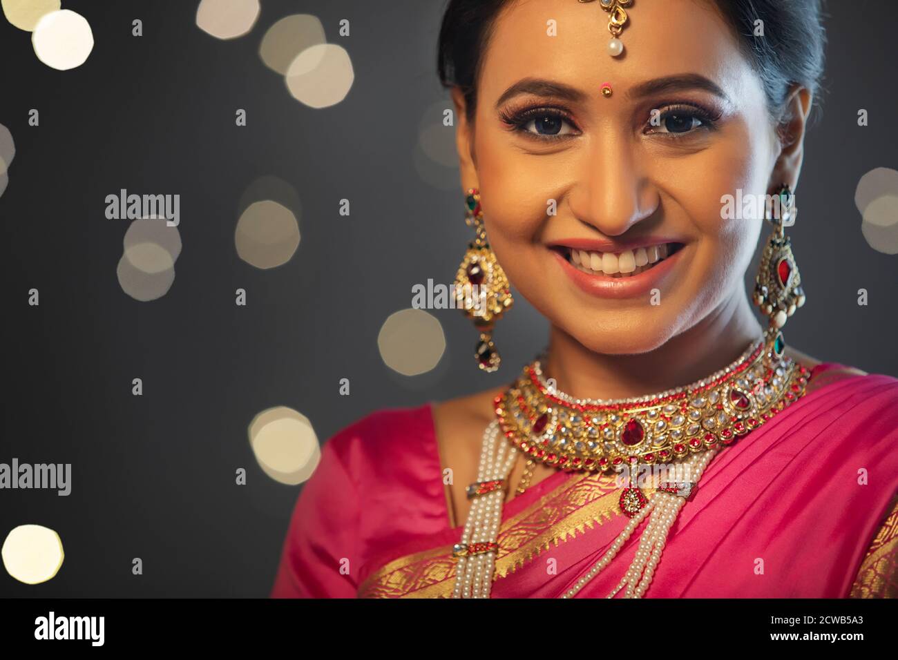 Woman in ethnic outfit smiling on the occasion of Diwali Stock Photo
