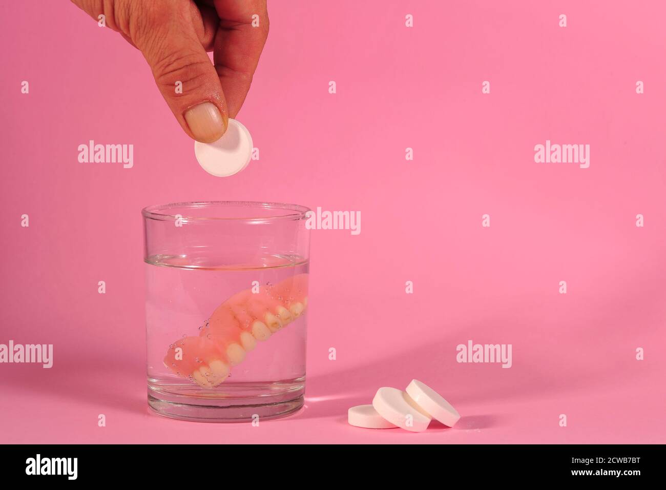 cleaning false teeth Stock Photo Alamy