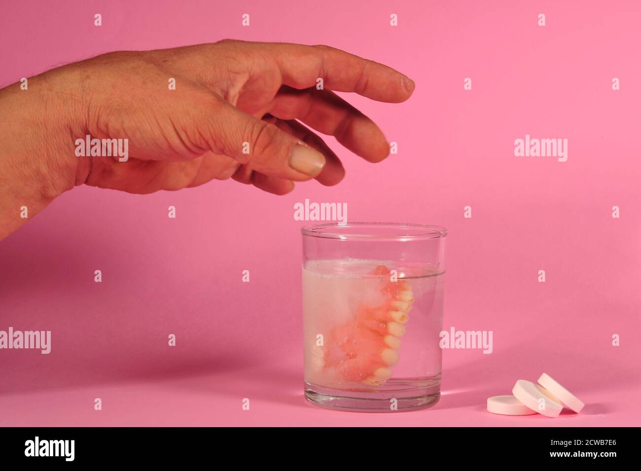 cleaning false teeth Stock Photo Alamy