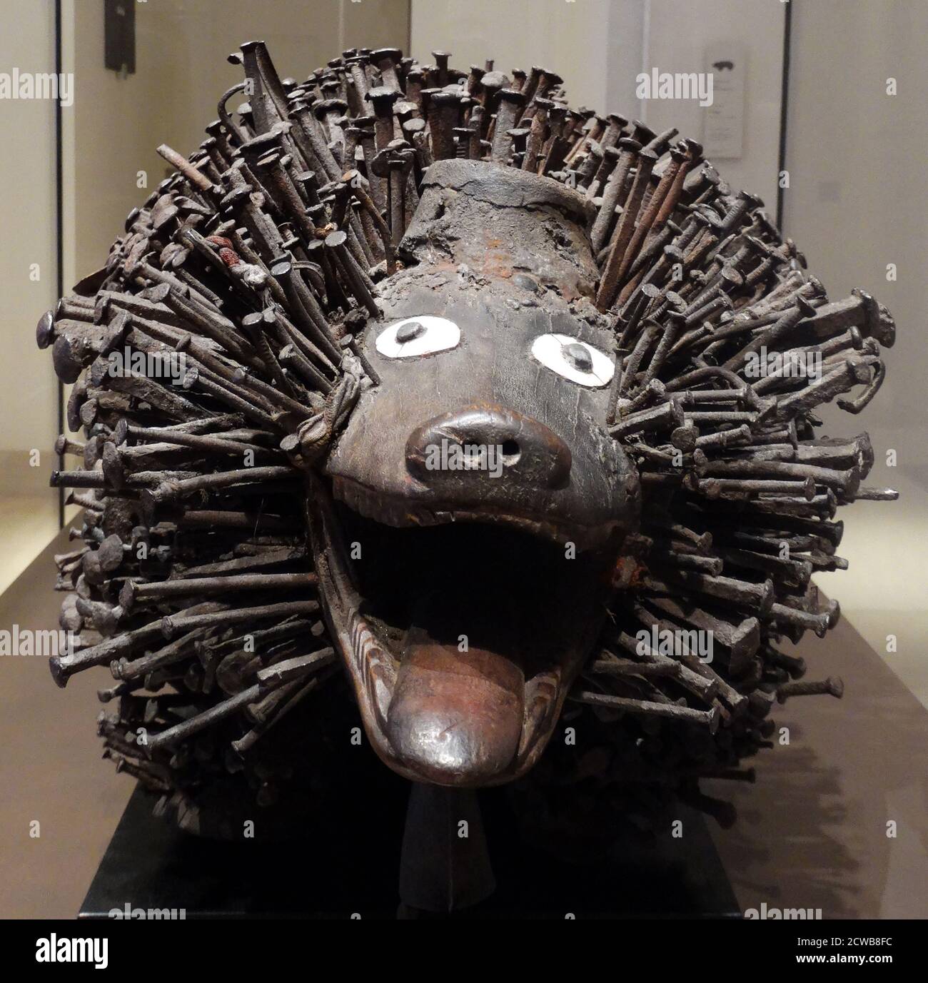 Protective statue of Nkisi made out of wood, metal, and porcelain Stock