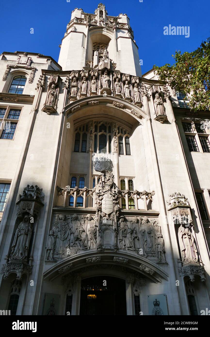 relief outside the Supreme Court, London. The Court is the final court of appeal in the United Kingdom. Scenes on the frieze include King John handing the Magna Carta to the barons at Runnymede, the granting of the charter of Westminster Abbey, and the Duke of Northumberland offering the crown of England to Lady Jane Grey. Stock Photo