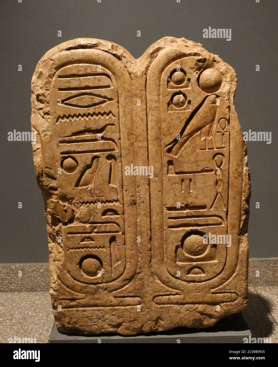 Inscribed limestone block with cartouches containing the name of the King Akhenaton Stock Photo
