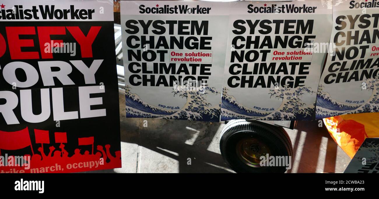 Socialist Workers Party literature, London, during the 20th September 2019 climate strike. Also known as the Global Week for Future, a series of international strikes and protests to demand action be taken to address climate change. The 20 September protests were likely the largest climate strikes in world history. Organisers reported that over 4 million people participated in strikes worldwide, including 300000 people joined UK protests Stock Photo