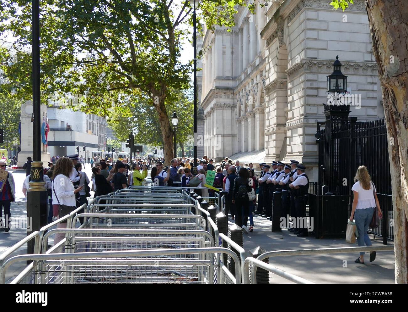 Downing Street, London, the office of the Prime Minister is protected by extra police, during the 20th September 2019 climate strike. Also known as the Global Week for Future, a series of international strikes and protests to demand action be taken to address climate change. The 20 September protests were likely the largest climate strikes in world history. Organisers reported that over 4 million people participated in strikes worldwide, including 300000 people joined UK protests Stock Photo