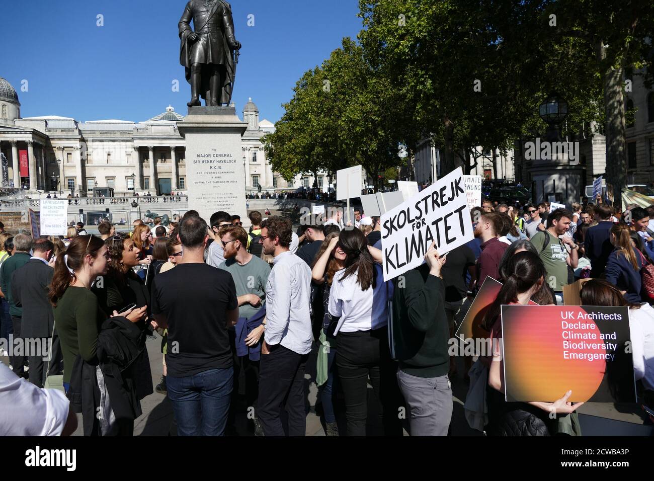 Protesters march in Trafalgar Square, London, during the 20th September 2019 climate strike. Also known as the Global Week for Future, a series of international strikes and protests to demand action be taken to address climate change. The 20 September protests were likely the largest climate strikes in world history. Organisers reported that over 4 million people participated in strikes worldwide, including 300000 people joined UK protests Stock Photo