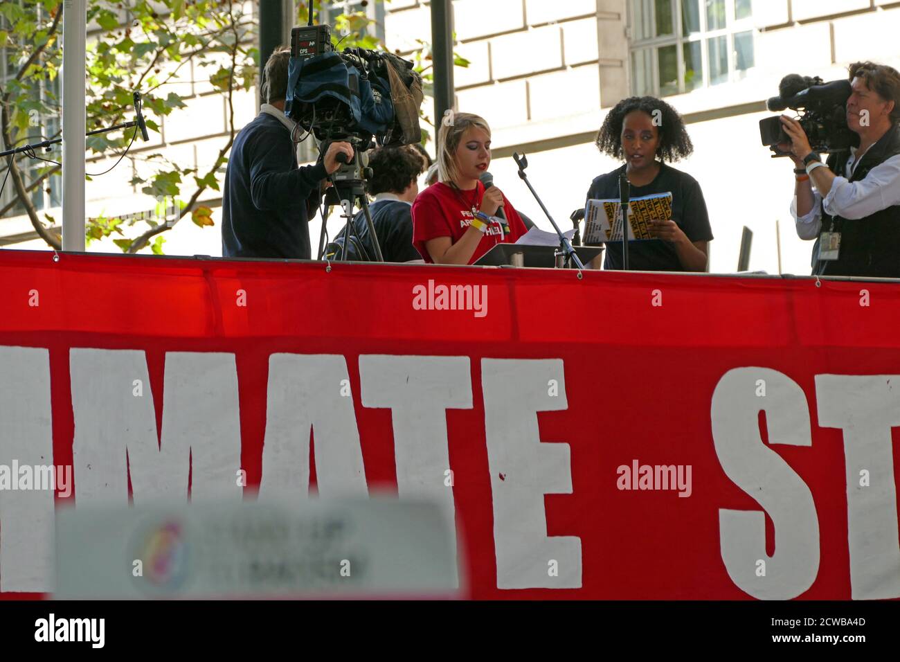 Anna Taylor (18) a UK leader of the youth climate strike addresses rally at Milbank, near Parliament, London, during the 20th September 2019 climate strike. Also known as the Global Week for Future, a series of international strikes and protests to demand action be taken to address climate change. The 20 September protests were likely the largest climate strikes in world history. Organisers reported that over 4 million people participated in strikes worldwide, including 300000 people joined UK protests. Greta Thunberg, (born 3 January 2003), Swedish environmental activist, credited with raisin Stock Photo