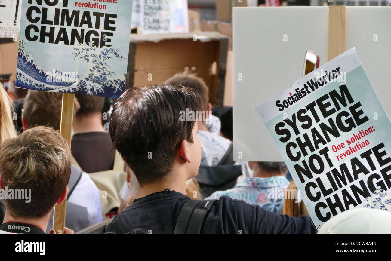 Protesters at a rally at Milbank, near Parliament, London, during the 20th September 2019 climate strike. Also known as the Global Week for Future, a series of international strikes and protests to demand action be taken to address climate change. The 20 September protests were likely the largest climate strikes in world history. Organisers reported that over 4 million people participated in strikes worldwide, including 300000 people joined UK protests. Greta Thunberg, (born 3 January 2003), Swedish environmental activist, credited with raising global awareness of the risks posed by climate ch Stock Photo