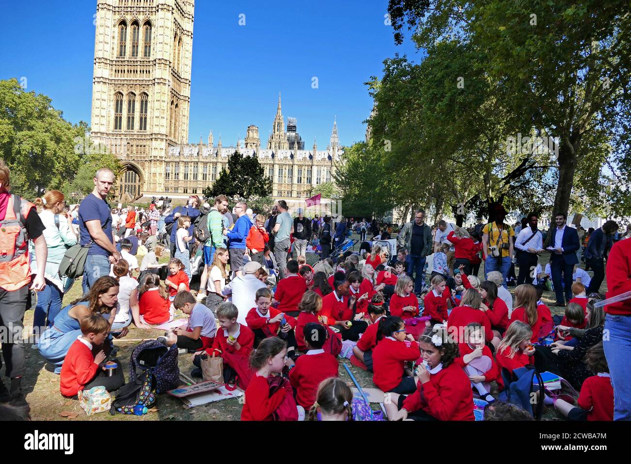 Protesters at a rally at Victoria Park, near Parliament, London, during the 20th September 2019 climate strike. Also known as the Global Week for Future, a series of international strikes and protests to demand action be taken to address climate change. The 20 September protests were likely the largest climate strikes in world history. Organisers reported that over 4 million people participated in strikes worldwide, including 300000 people joined UK protests. Greta Thunberg, (born 3 January 2003), Swedish environmental activist, credited with raising global awareness of the risks posed by clim Stock Photo