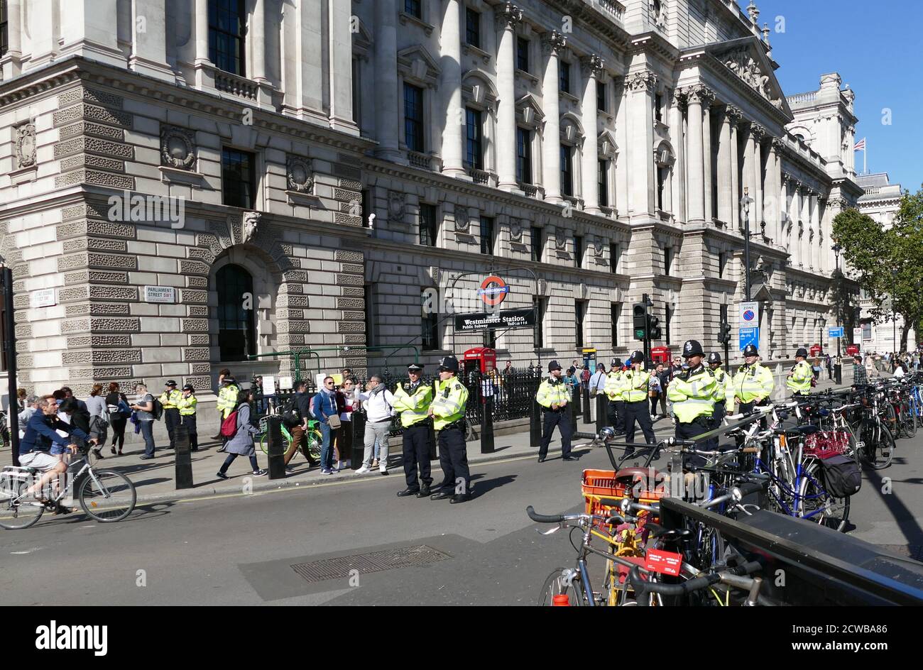 Police guard Whitehall, London, during the 20th September 2019 climate strike. Also known as the Global Week for Future, a series of international strikes and protests to demand action be taken to address climate change. The 20 September protests were likely the largest climate strikes in world history. Organisers reported that over 4 million people participated in strikes worldwide, including 300000 people joined UK protests Stock Photo