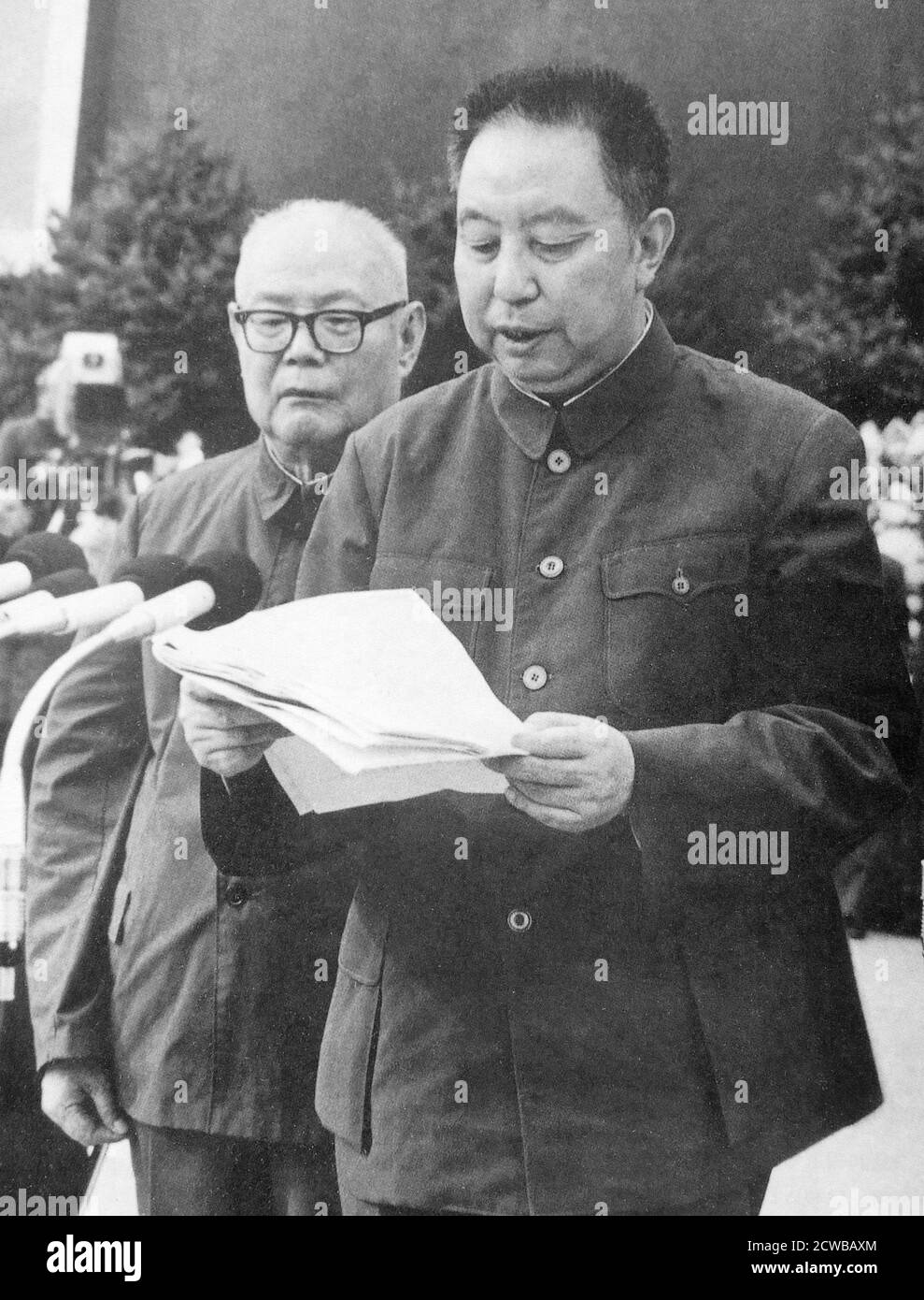 Hua Guofeng (1921 - 2008), Chinese politician who served as Chairman of the Communist Party of China and Premier of the People's Republic of China, 1976 - 1981. Next to him is Ye Jianying a Chinese communist revolutionary leader and politician, one of the founding Ten Marshals of the People's Liberation Army. Stock Photo