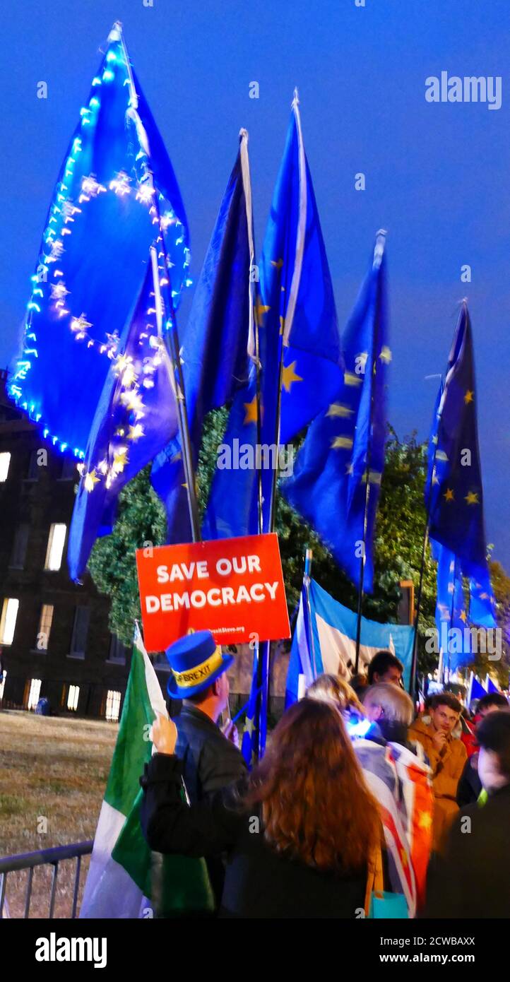 Pro-remain demonstrators opposite the British parliament sits on the night of its prorogation by the Queen. Prorogation of the Parliament of the United Kingdom was ordered by Queen Elizabeth II upon the advice of the Conservative Prime Minister, Boris Johnson, on 28 August 2019. opposition politicians saw this as an unconstitutional attempt to reduce parliamentary scrutiny of the Government's Brexit plan. A decision that the prorogation was unlawful was made by the Supreme Court of the United Kingdom on 24th September 2019. Stock Photo