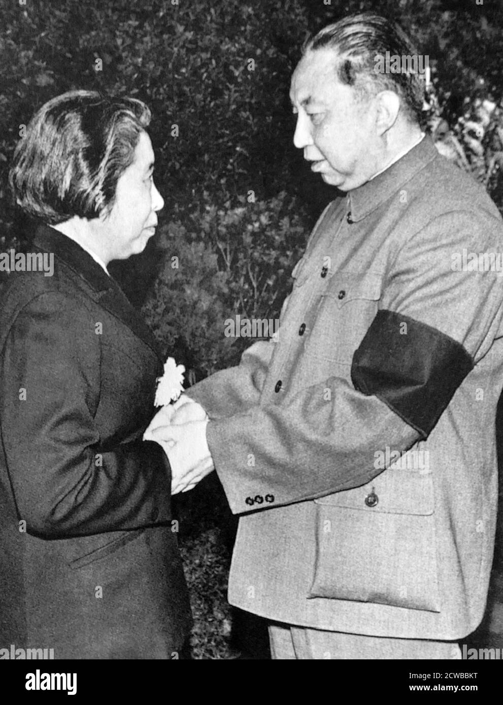 Chinese leader Hua Guofeng with Deng Yingchao (1904 - 1992), the wife of the first Chinese Premier, Zhou Enlai. 1977 Stock Photo