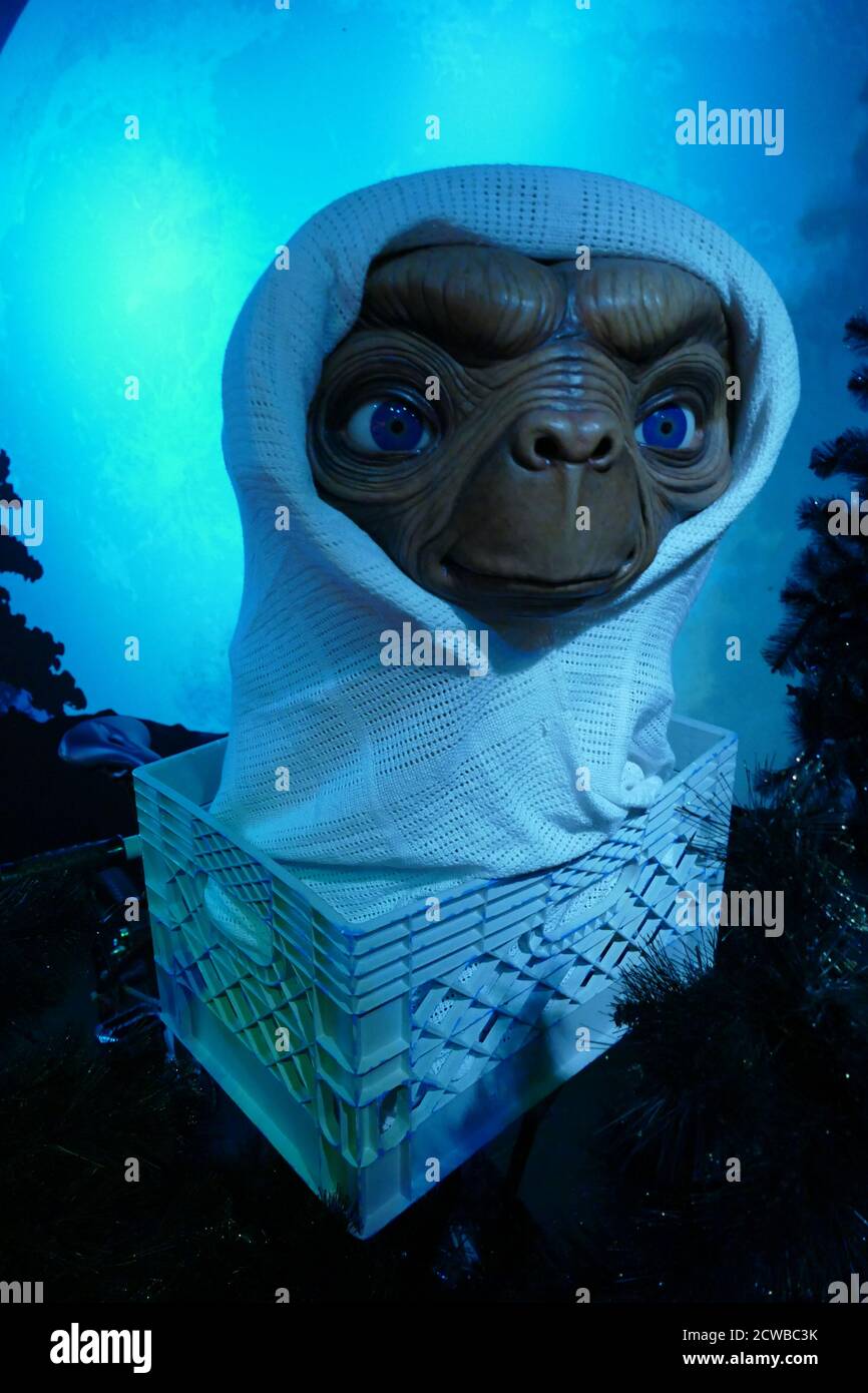 E.T. the Extra-Terrestrial is a 1982 American science fiction film produced and directed by Steven Spielberg, and written by Melissa Mathison. It tells the story of Elliott (Thomas), a boy who befriends an extra-terrestrial, dubbed 'E.T.' stranded on Earth. Elliott and his siblings help E.T. return to his home planet, while attempting to keep him hidden from the government. Stock Photo