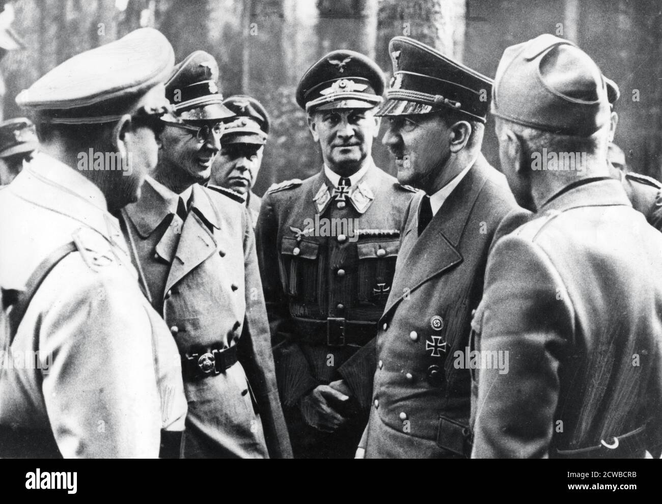Adolf Hitler with Benito Mussolini and senior Nazis, 1944. The photograph was taken after the unsuccessful attempt on Hitler's life on 20 July 1944. Left to right: Reichsmarschall Hermann Goering, Reichsfuhrer Heinrich Himmler, Colonel General Loerzer, Hitler, Mussolini. The photographer is unknown. Stock Photo