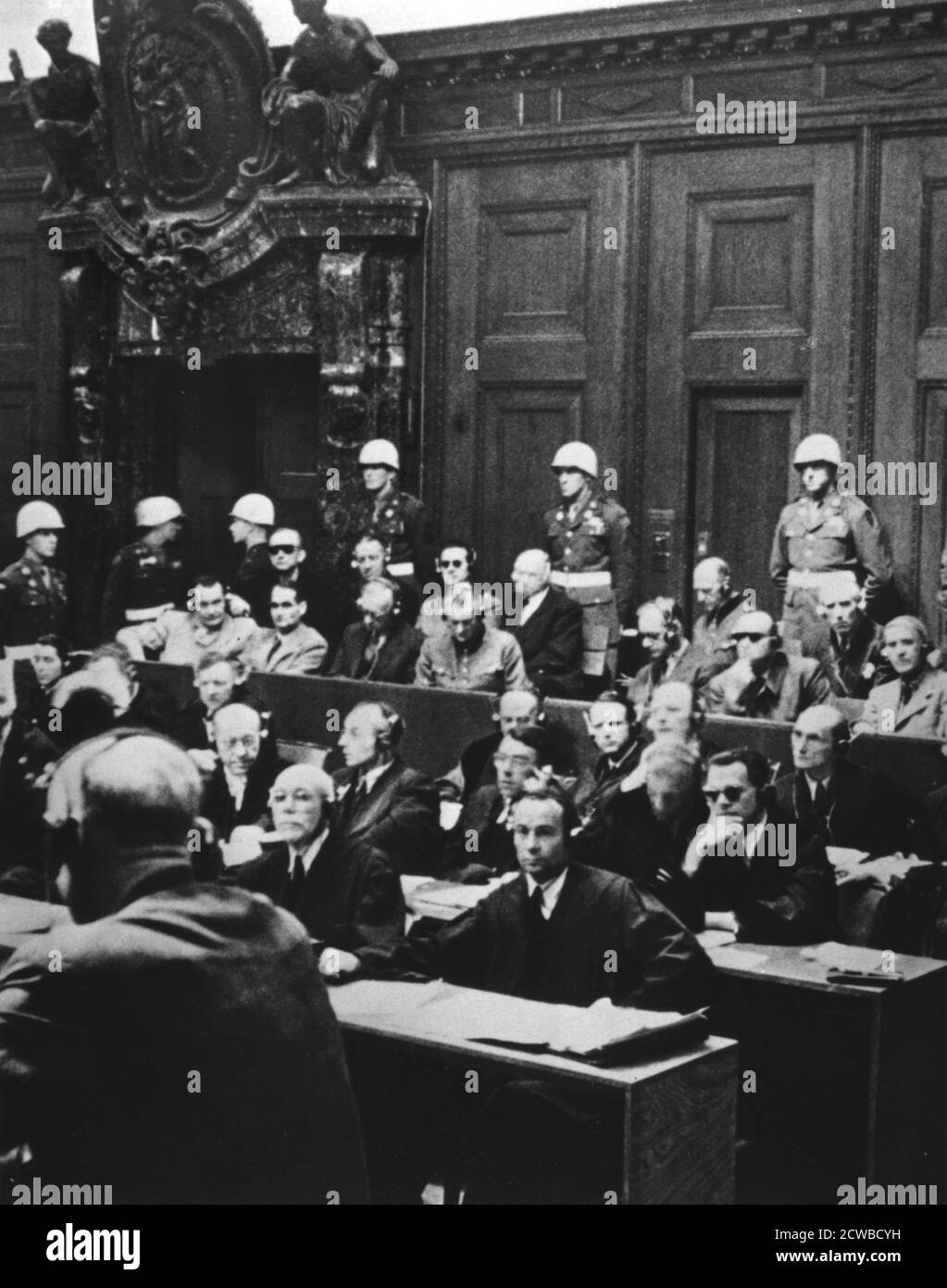 Nuremberg war crimes trial, Germany, 1946. Between 20 November 1945 and 1 October 1946 the 24 surviving most senior Nazi leaders were tried before the International Military Tribunal in the Palace of Justice in Nuremberg. The defendants are ack row (left to right): Admiral Karl Doenitz, Admiral Erich Raeder, Baldur von Schirach (leader of the Hitler Youth), Fritz Sauckel (head of the Nazi slave labour programme), General Alfred Jodl, Franz von Papen. Front row (left to right): Hermann Goering, Rudolf Hess, Joachim von Ribbentrop (Foreign Minister), Field Marshal Wilhelm Keitel, Alfred Rosenber Stock Photo