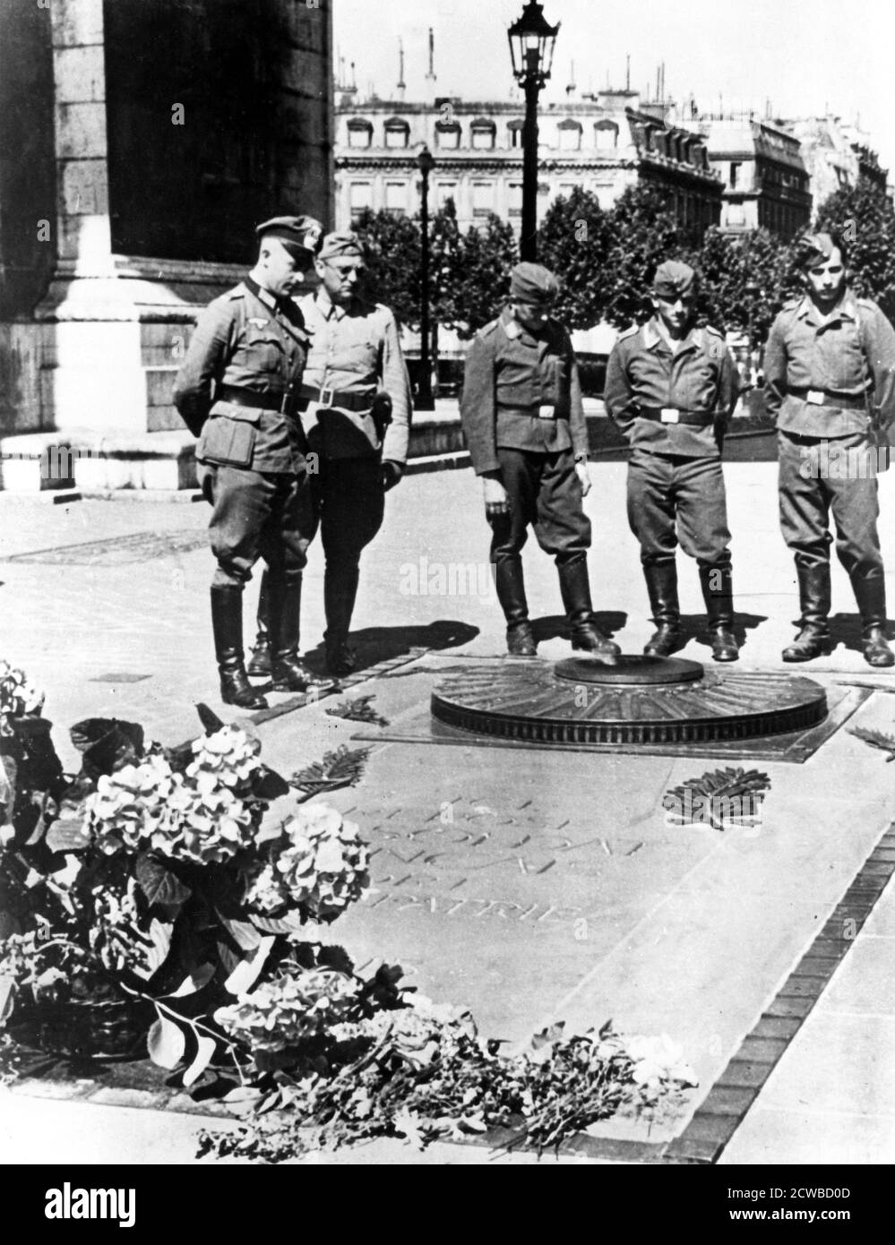 German soldiers at the Tomb of the Unknown Soldier at the Arc de Triomphe, Paris, December 1940. The photographer is unknown. Stock Photo