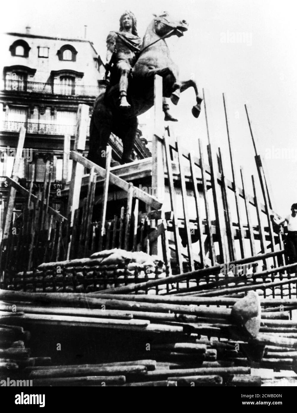 Protective measures for the statue of Louis XIV, Paris, 1940. The photographer is unknown. Stock Photo