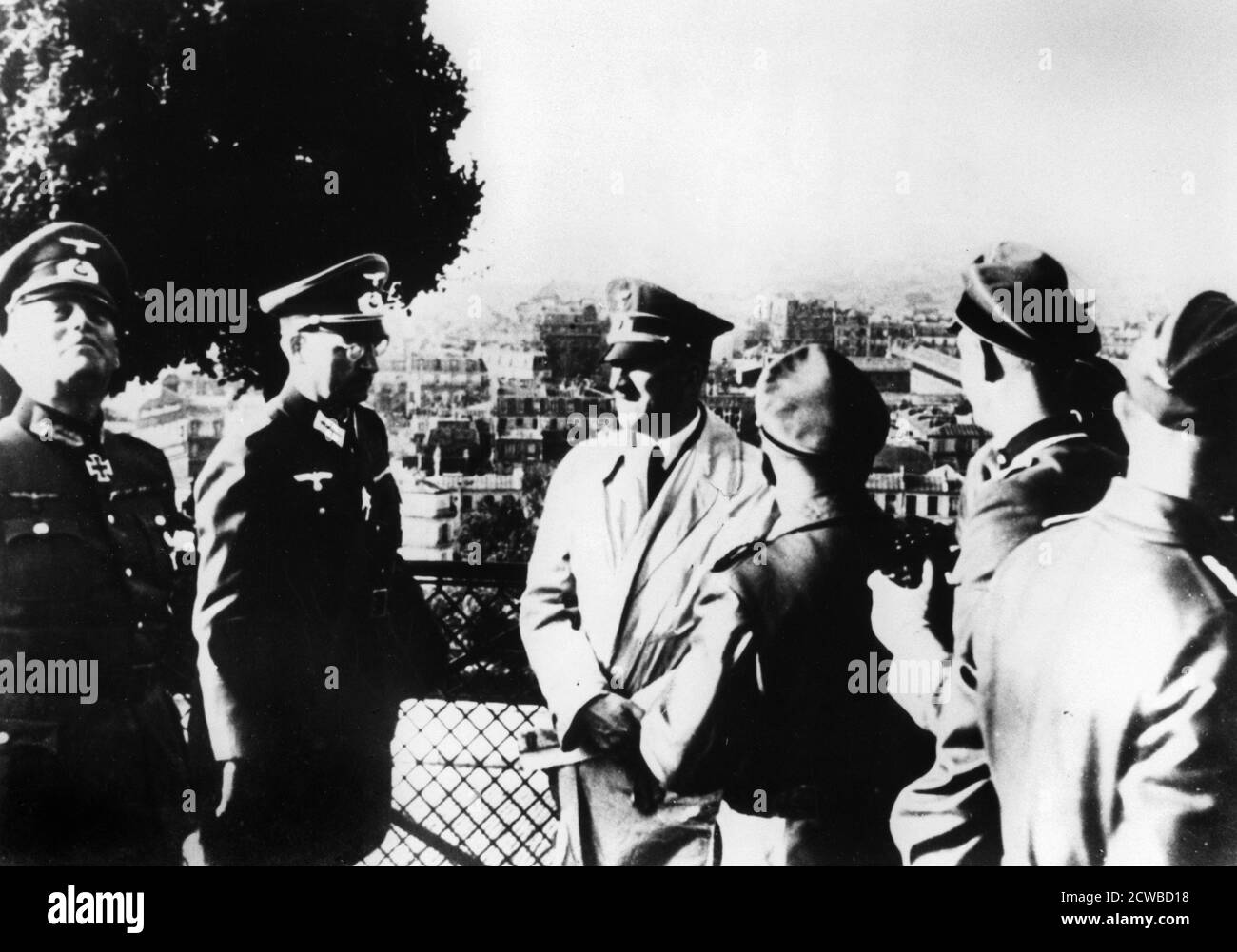 Adolf Hitler visiting the occupied city of Paris, 1940. The two officers to the left of the Nazi leader are Colonel-General (later Field Marshal) Wilhelm Keitel and Colonel Hans Speidel. Speidel would later be involved in the plot to assassinate Hitler in July 1944. He survived the reprisals after the plot and became a senior general in NATO after the war. The photographer is unknown. Stock Photo