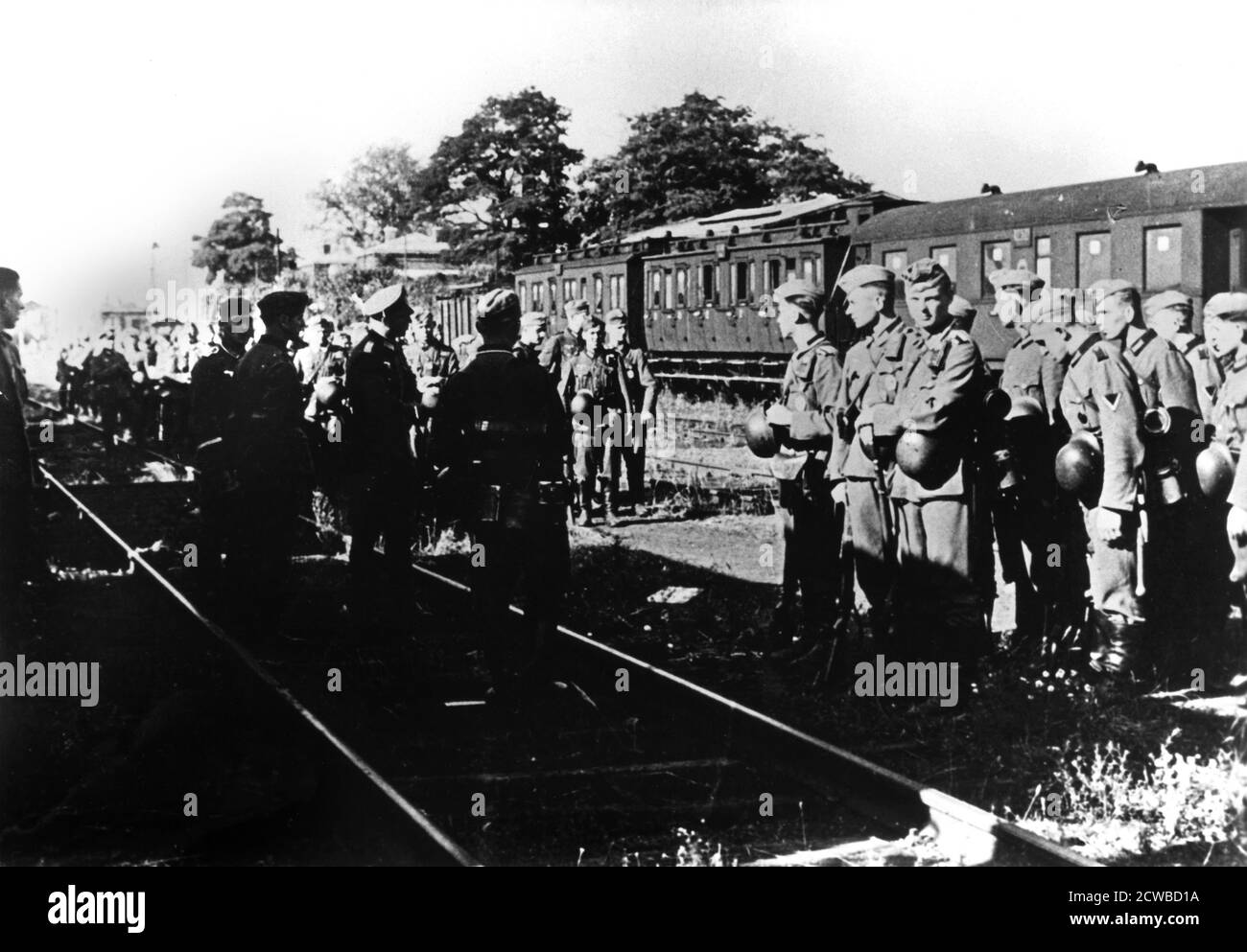 German soldiers awaiting transportation in a railway station in the Paris suburbs, August 1940. The photographer is unknown. Stock Photo