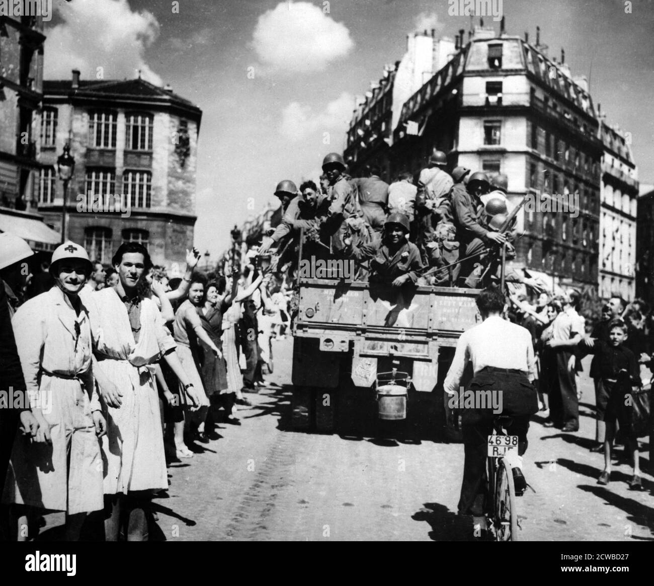 The liberation of Paris, August 1944. Jubilant crowds take to the streets to welcome their Allied liberators. The photographer is unknown. Stock Photo