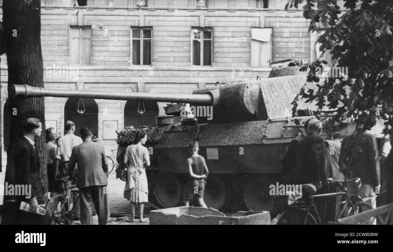 Abandoned German tank on the Rue Medicis, liberation of Paris, August 1944. After just over four years of occupation, the Germans surrendered the city to the French 2nd Armoured Division on 25 August 1944. The photographer is unknown. Stock Photo