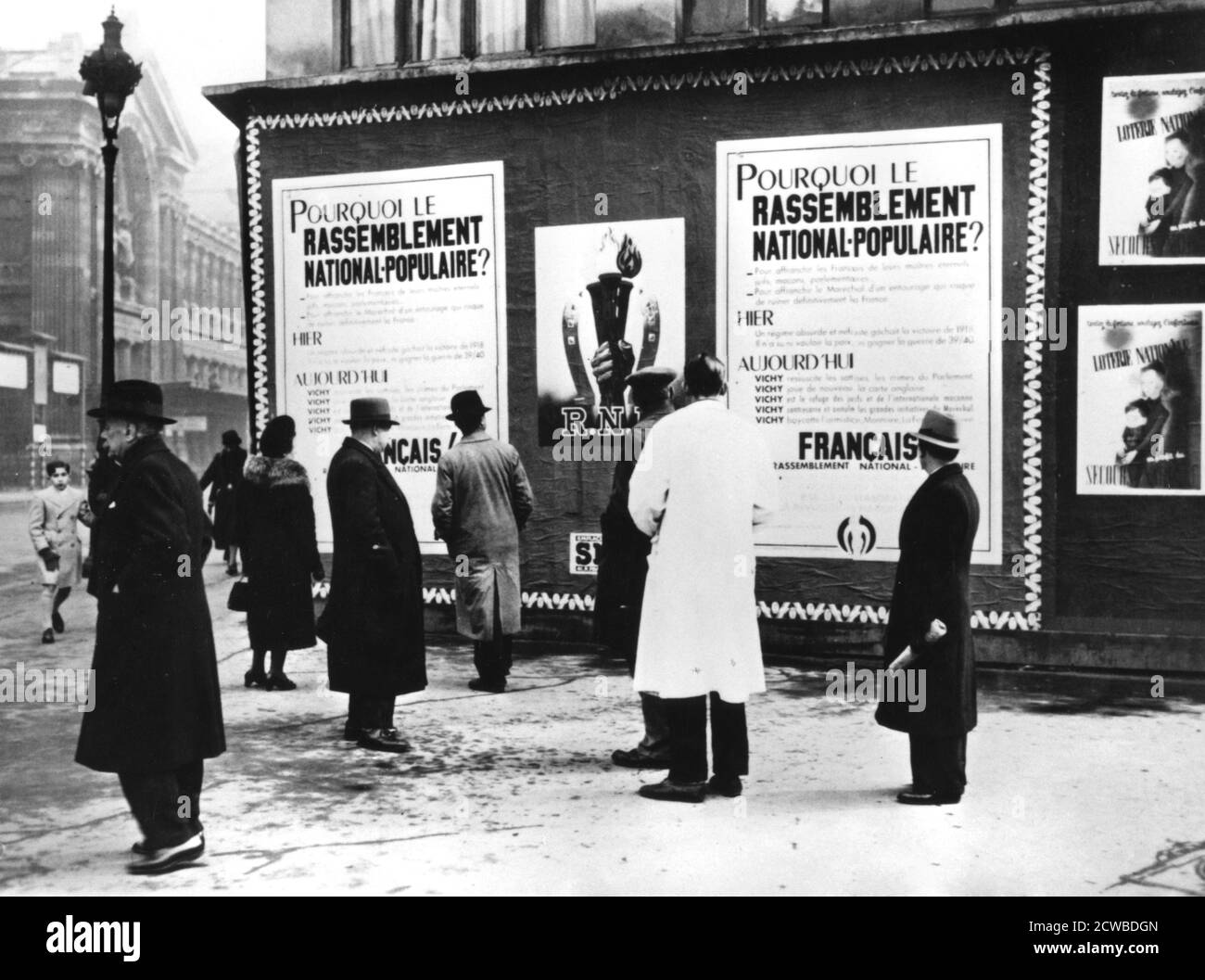 Billboard dispaying Rassemblement Nationale Populaire posters, German-occupied Paris, February 1941. The Rassmblement Nationale Populaire (RNP) was a French collaborator political party founded in February 1941 by Marcel Deat. The photographer is unknown. Stock Photo